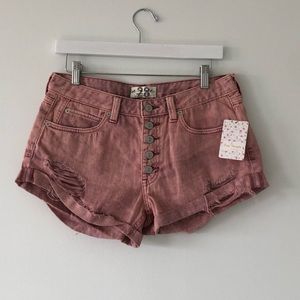 Free People pink distressed denim shorts